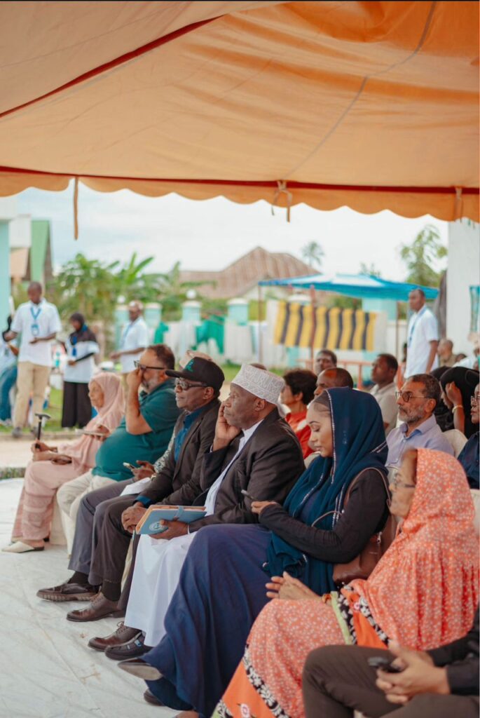 Community members witnessing distributions